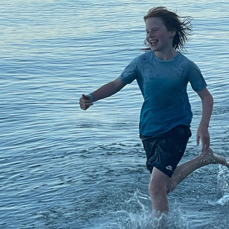 child and teen counselling - child running in the sea 
